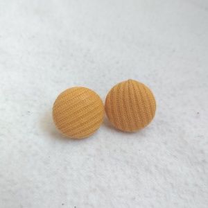 Mustard yellow button stud earrings.